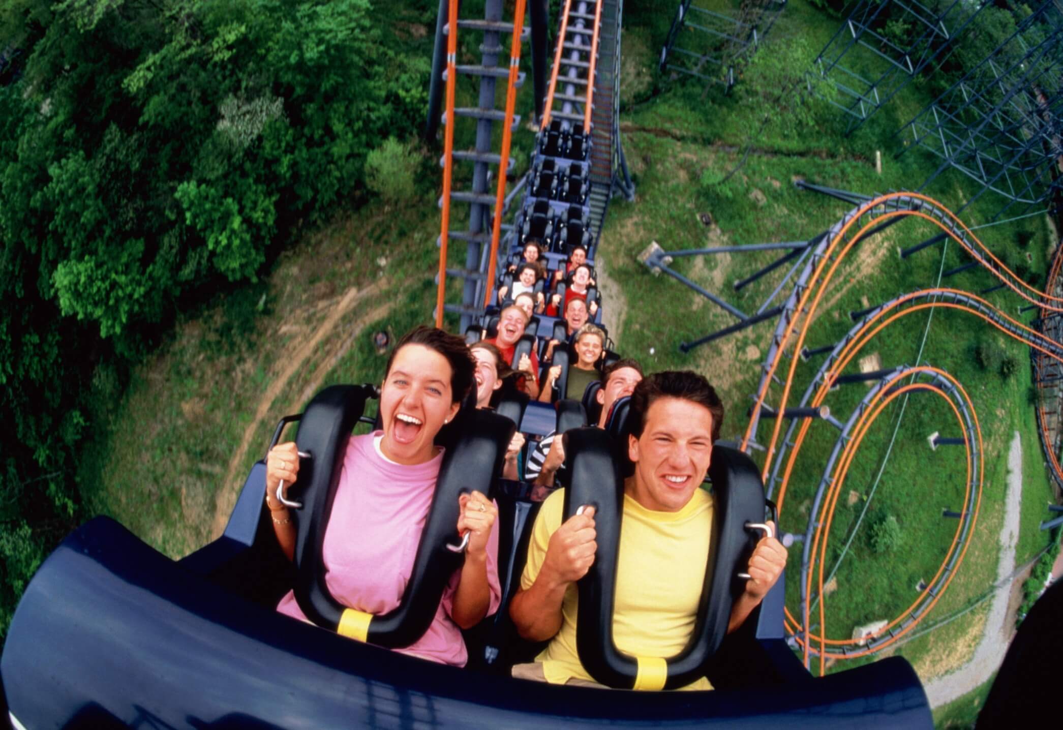 People on roller coaster, elevated view, (wide angle)